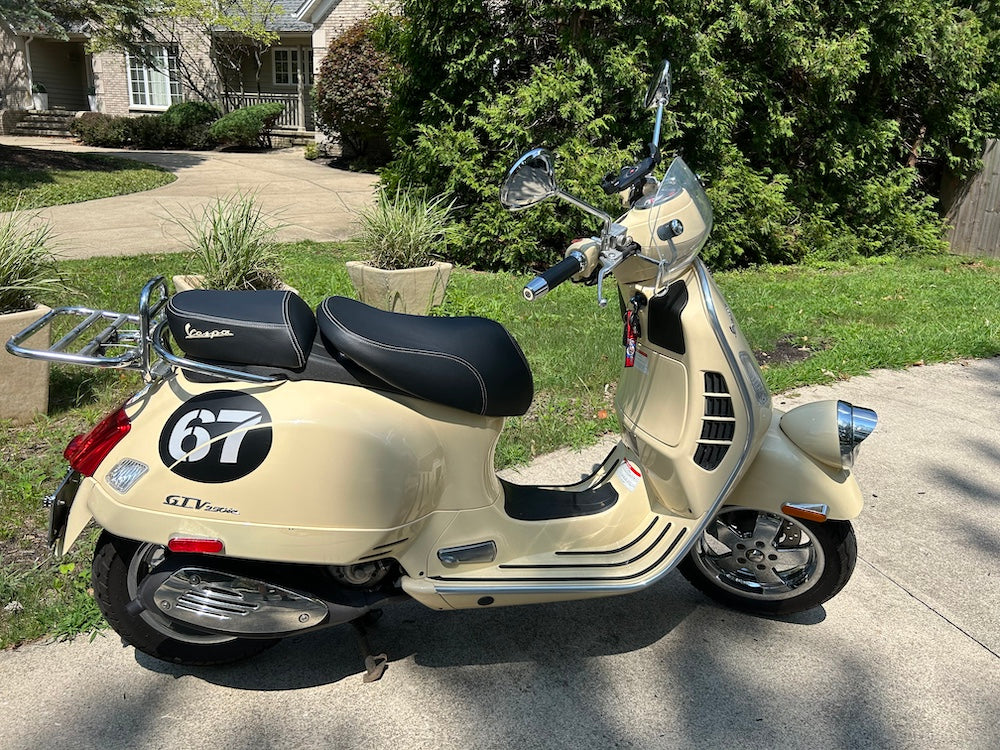 Vespa GTV black seat cover with cream contrasting stitching