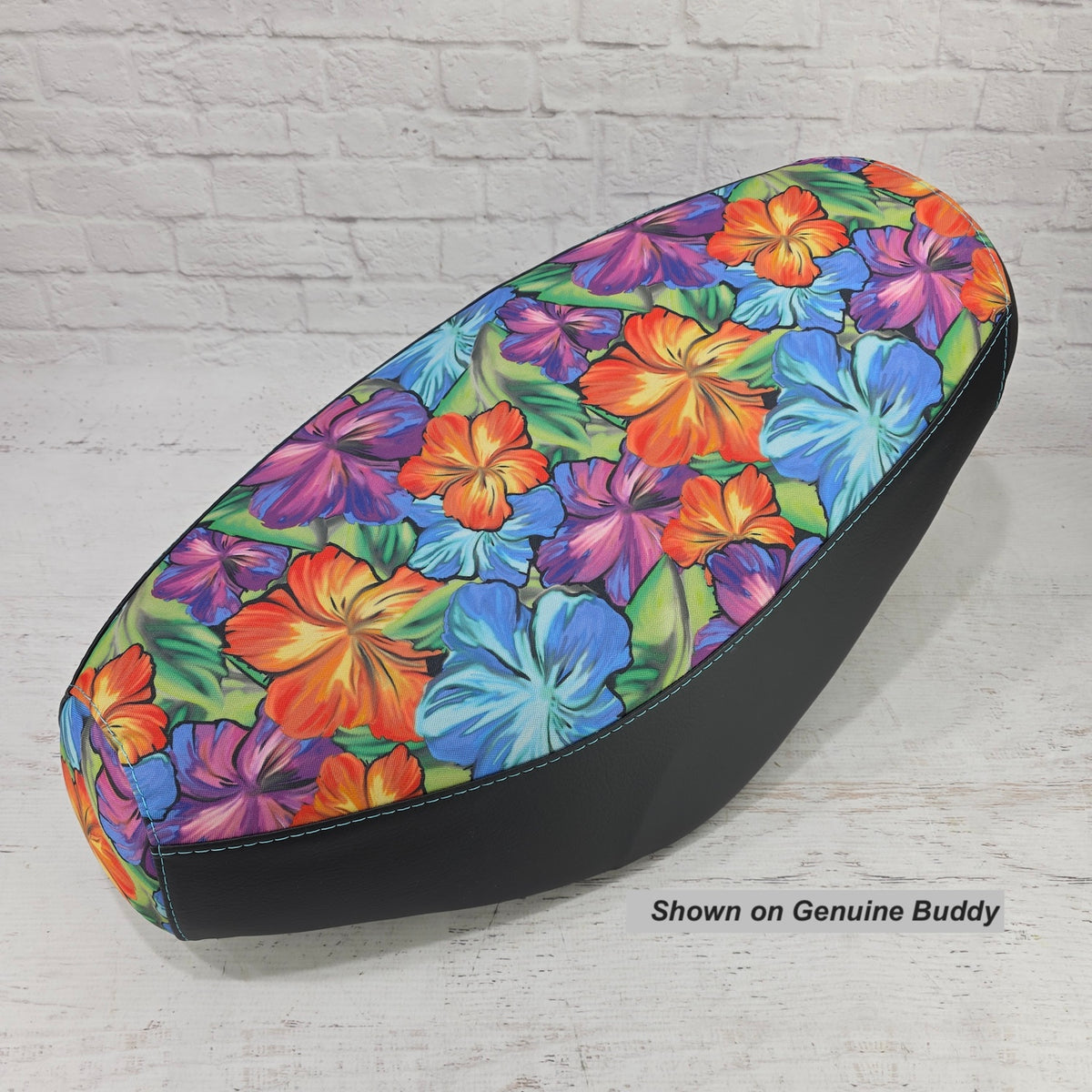 Hawaiian Flower seat cover tailored for a Genuine Buddy scooter, shown with its tropical print and black side panels, handmade by Cheeky Seats.