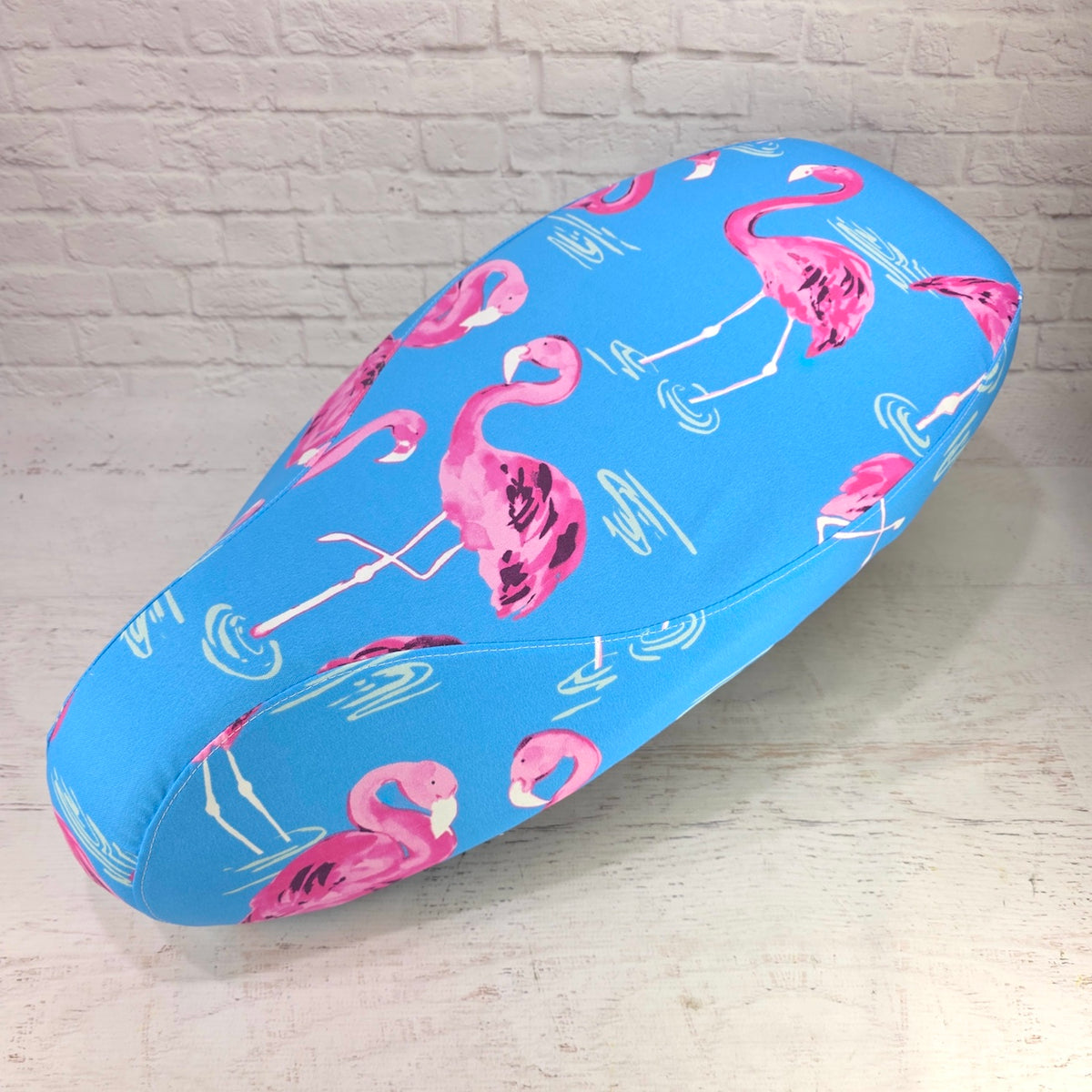 Pink Flamingos Vespa seat cover with a playful flamingo print and a smooth tailored fit, handmade by Cheeky Seats.