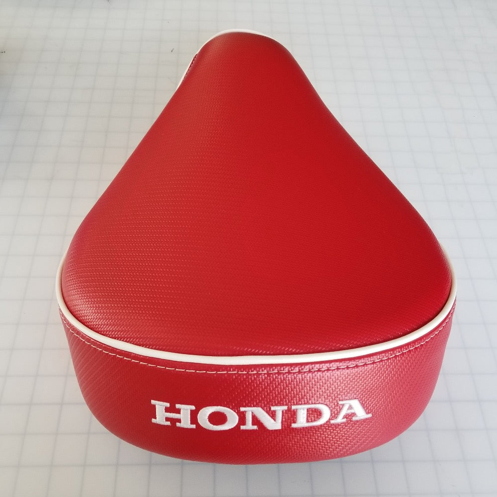 Honda Super Cub red carbon fiber seat cover detail