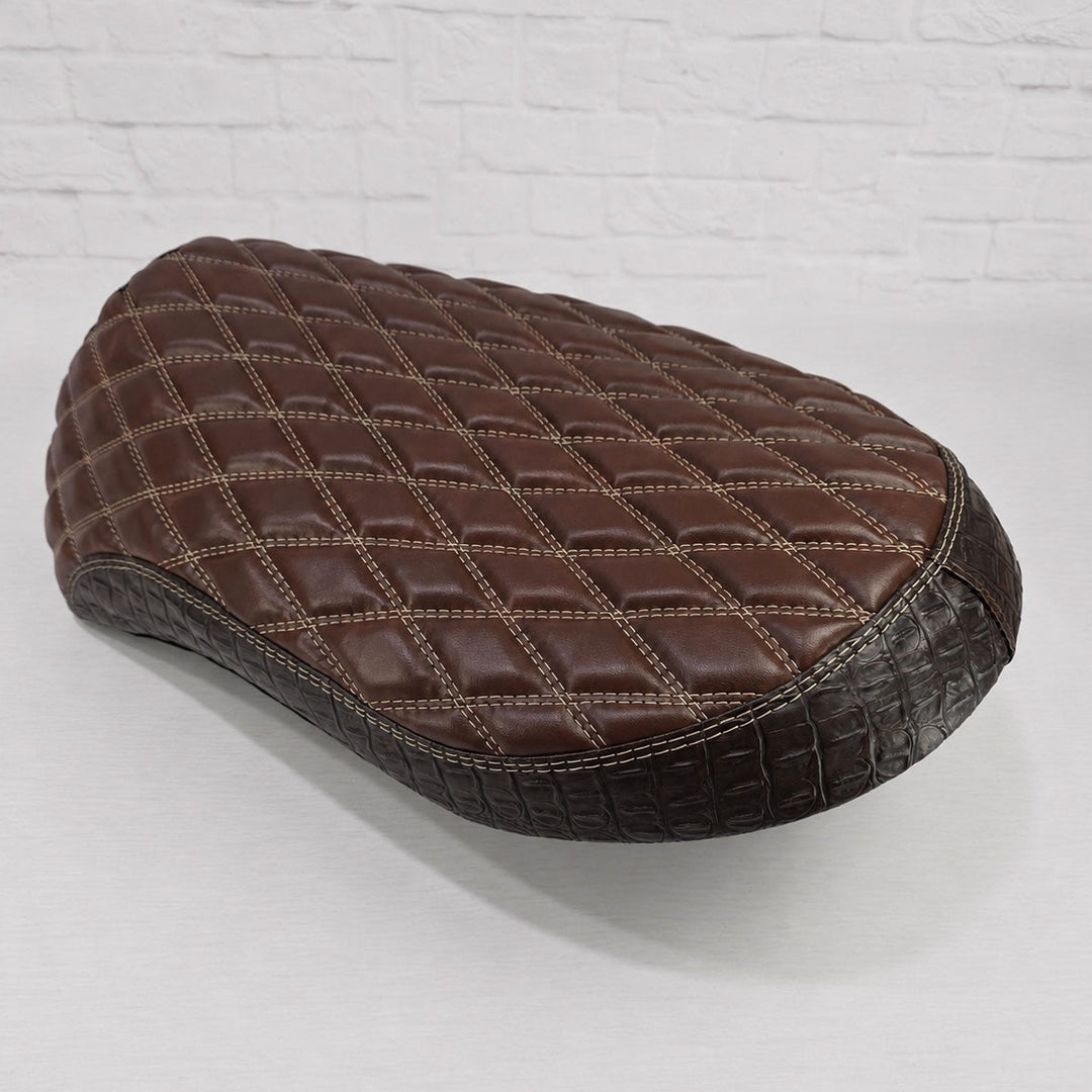 Brown diamond stitched seat cover with espresso croc sides on a white background