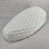 High front angle of a white Genuine Buddy Kick 125 seat cover with white double-diamond stitching, handmade by Cheeky Seats