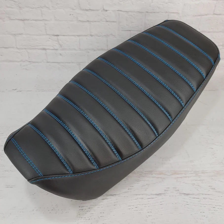 Black Honda Grom Seat Cover featuring tuck and roll stitching with Candy Blue OEM stitch color