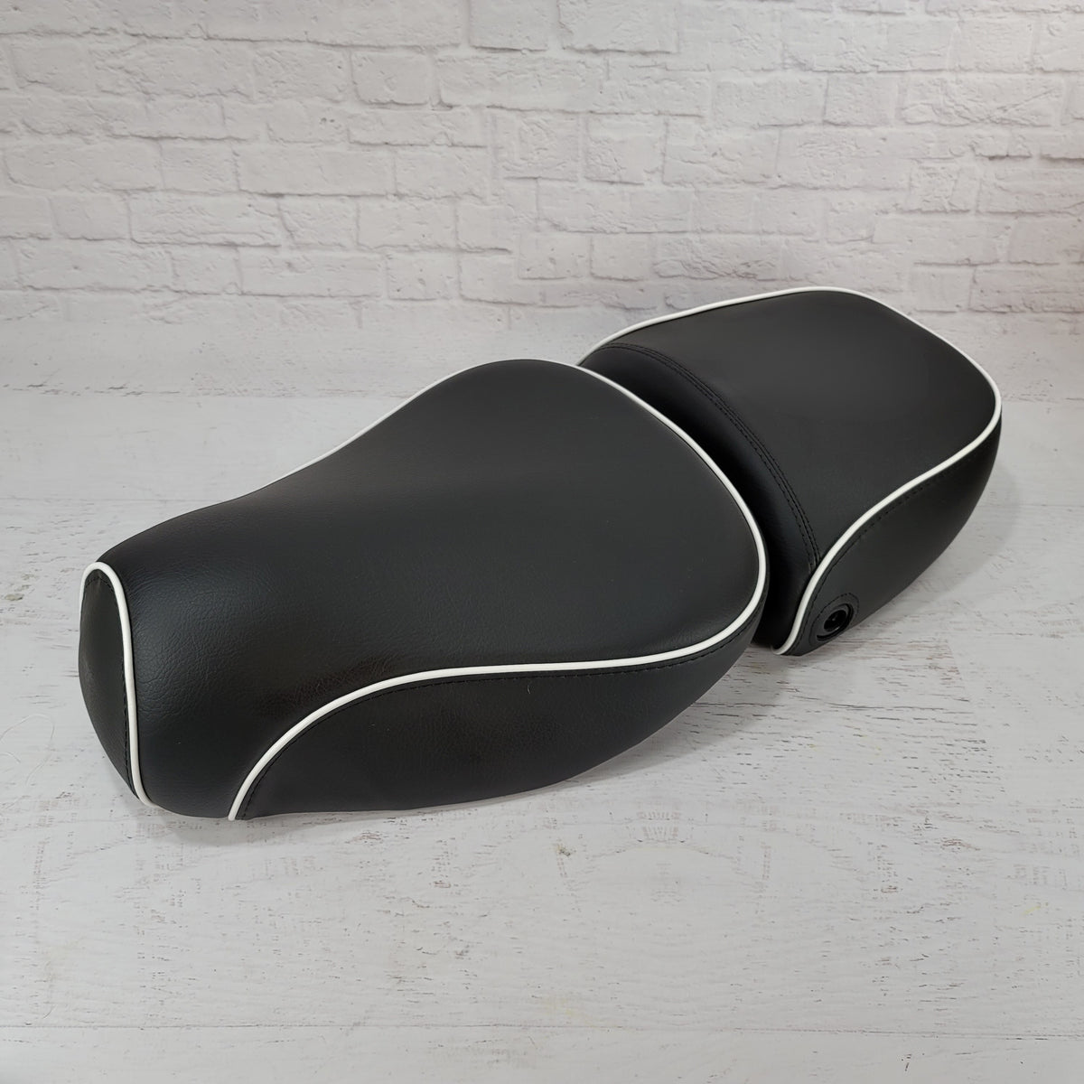 Vespa LXV black seat cover with white piping