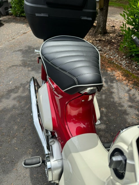 Honda Super Cub black tuck and roll seat cover on scooter